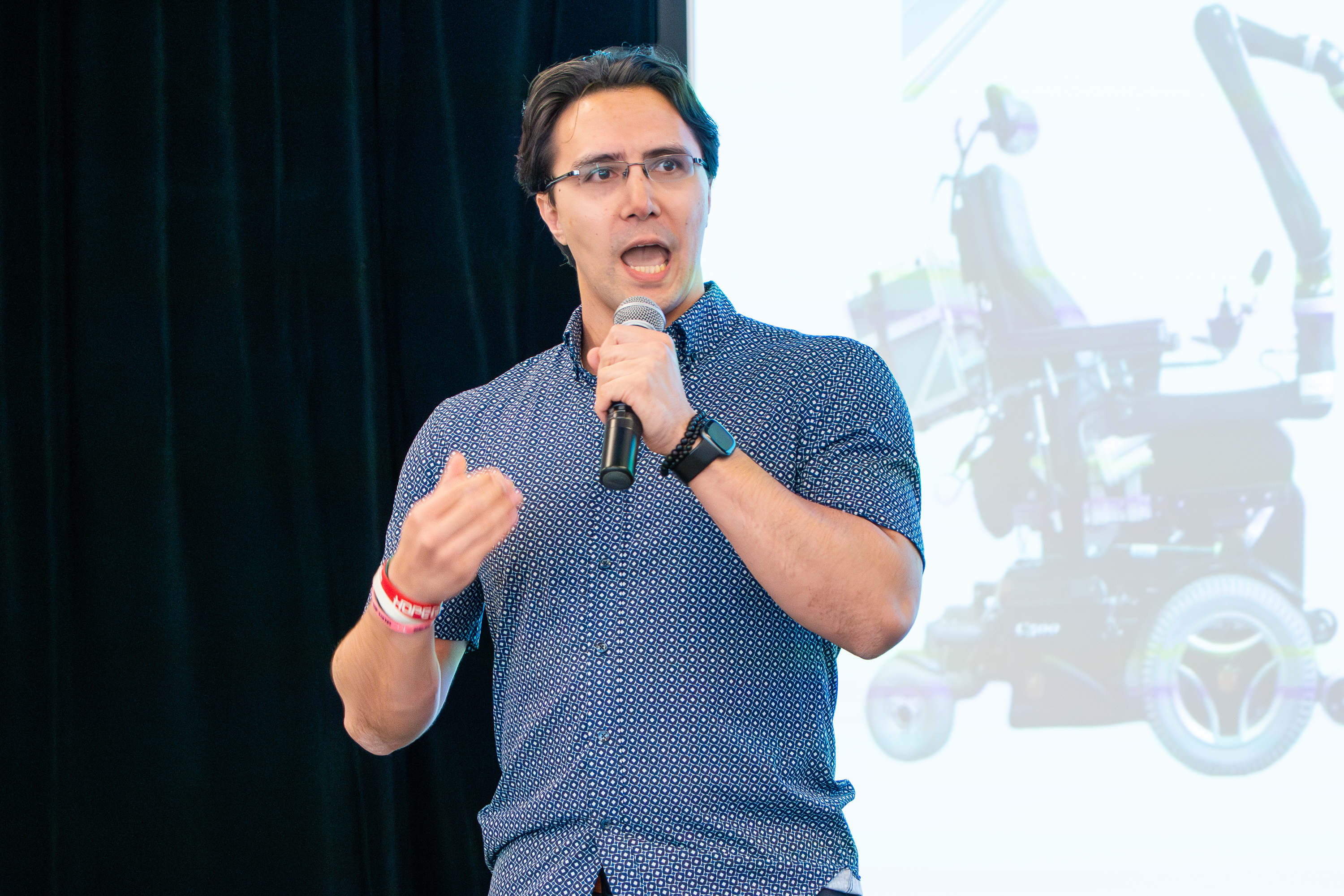 Picture of Michael Przystupa on stage giving his presentation