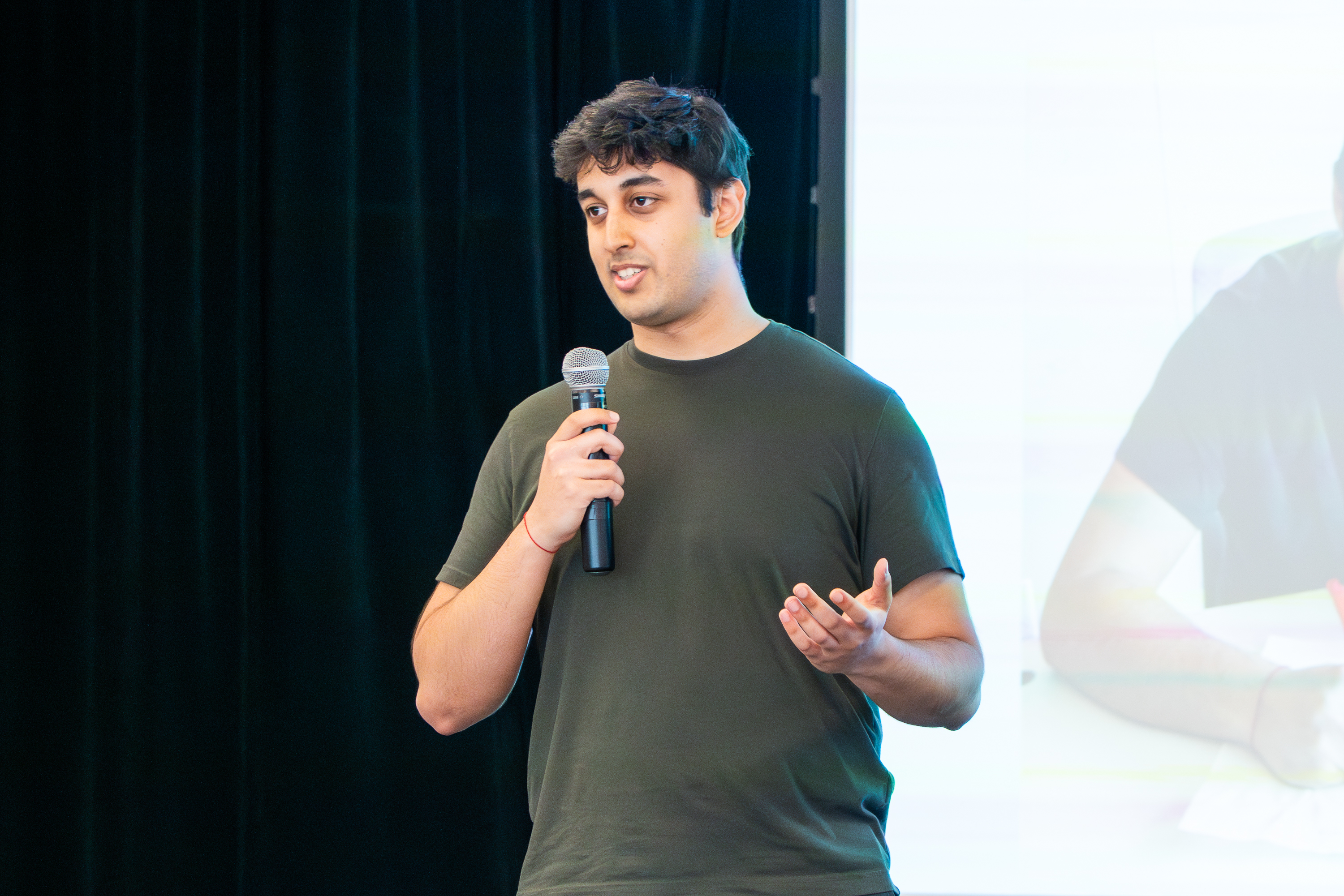 Kusha Sareen on stage giving his presentation
