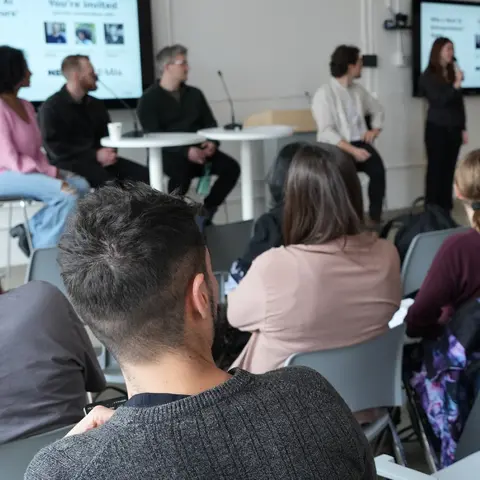 Participants listening to a panel of experts.