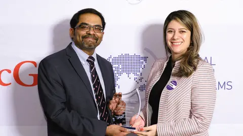 Picture of Professor Samira Rahimi receiving the Donald A. Henderson Prize