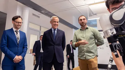 Photo of Canada's Prime Minister, Mark Carney, with Hugo Larochelle and professor Glen Berseth. 