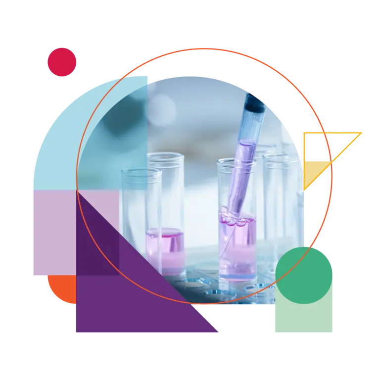 A researcher adding drops of liquid to a test tube using a micropipette.
