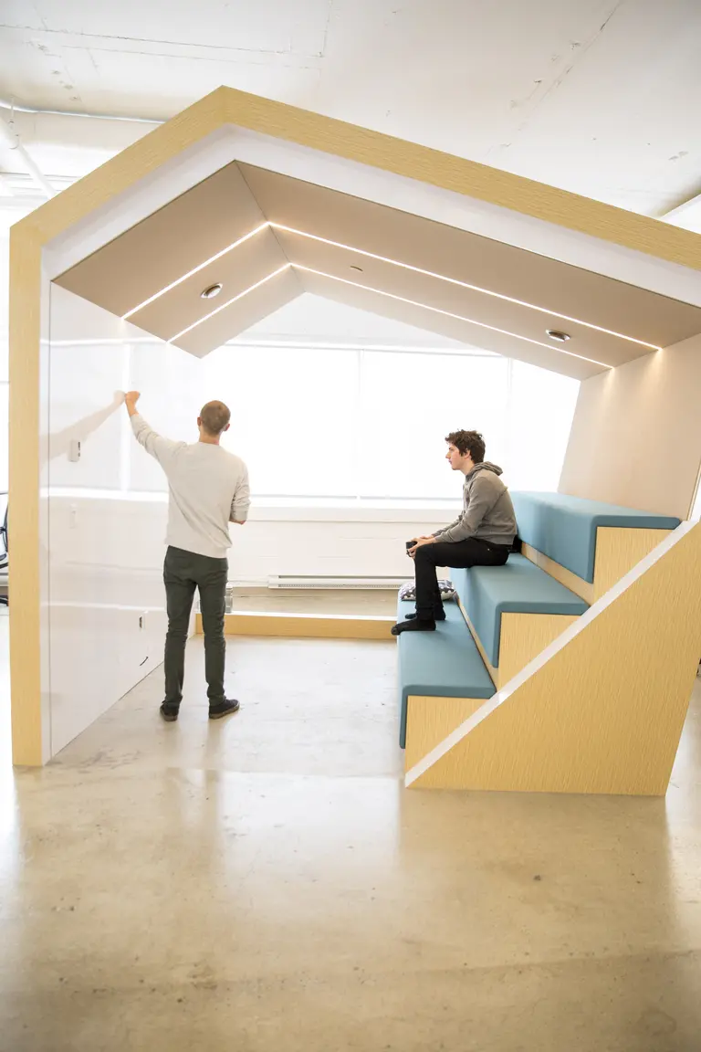 Two students working on algorithms at Mila.