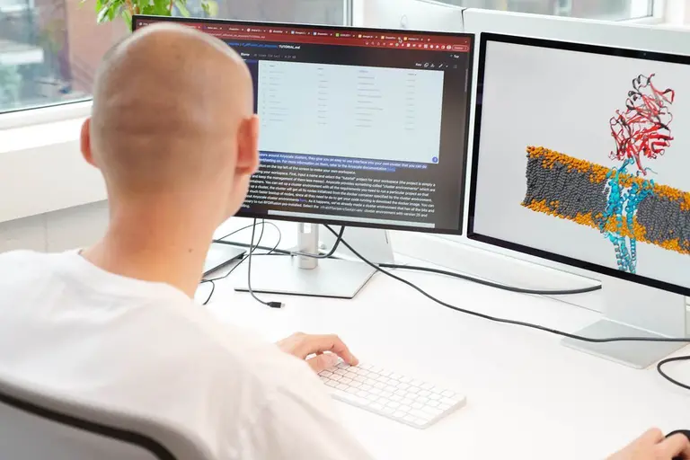 A Dreamfold employee working at his computer