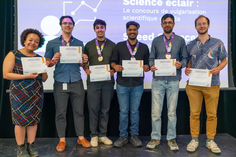 Group picture of all the participants of Mila Speed Science contest holding their certificate