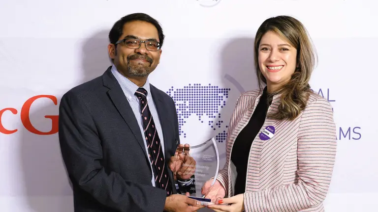 Picture of Professor Samira Rahimi receiving the Donald A. Henderson Prize