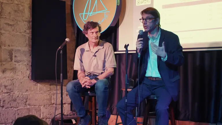 two speakers on stage during the After Mila event