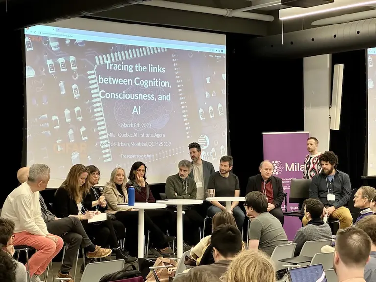 Blake Richards, Guillaume Lajoie and a panel of multidisciplinary experts during a workshop