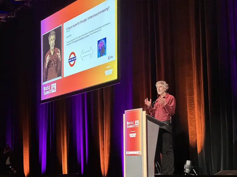 Yoshua Bengio on stage during World Summit AI conference
