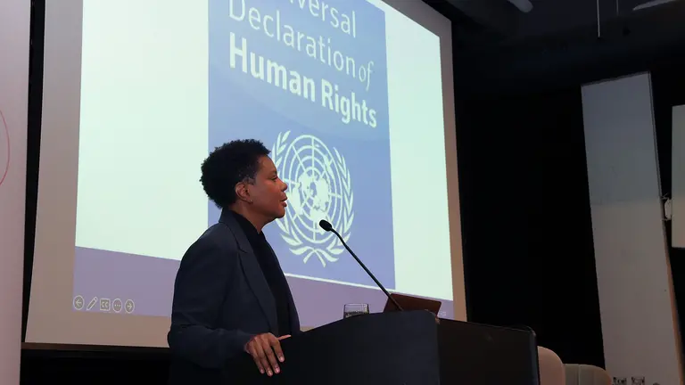 Alondra Nelson speaking in front of an audience at Mila. 