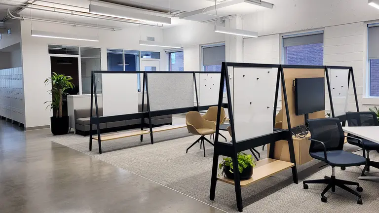 Photo of a new collaborative space in the Mila offices. 