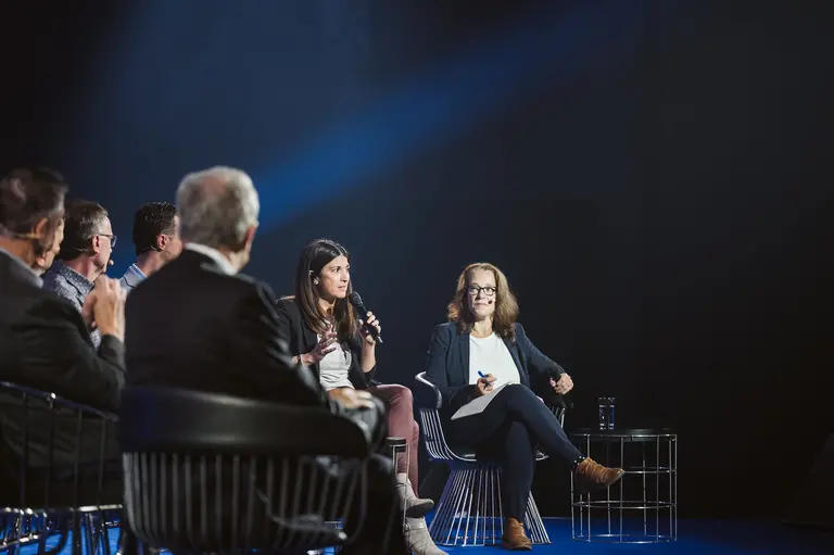 Valérie Pisano speaking at a panel discussion at ALL IN.