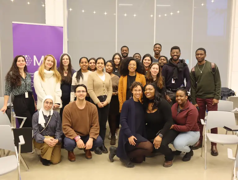 Group photo taken at a research talk organized by the Black at Mila collective.