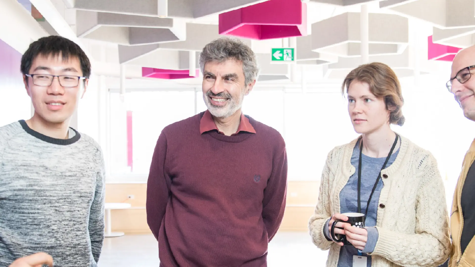 Yoshua Bengio talking with professors and students