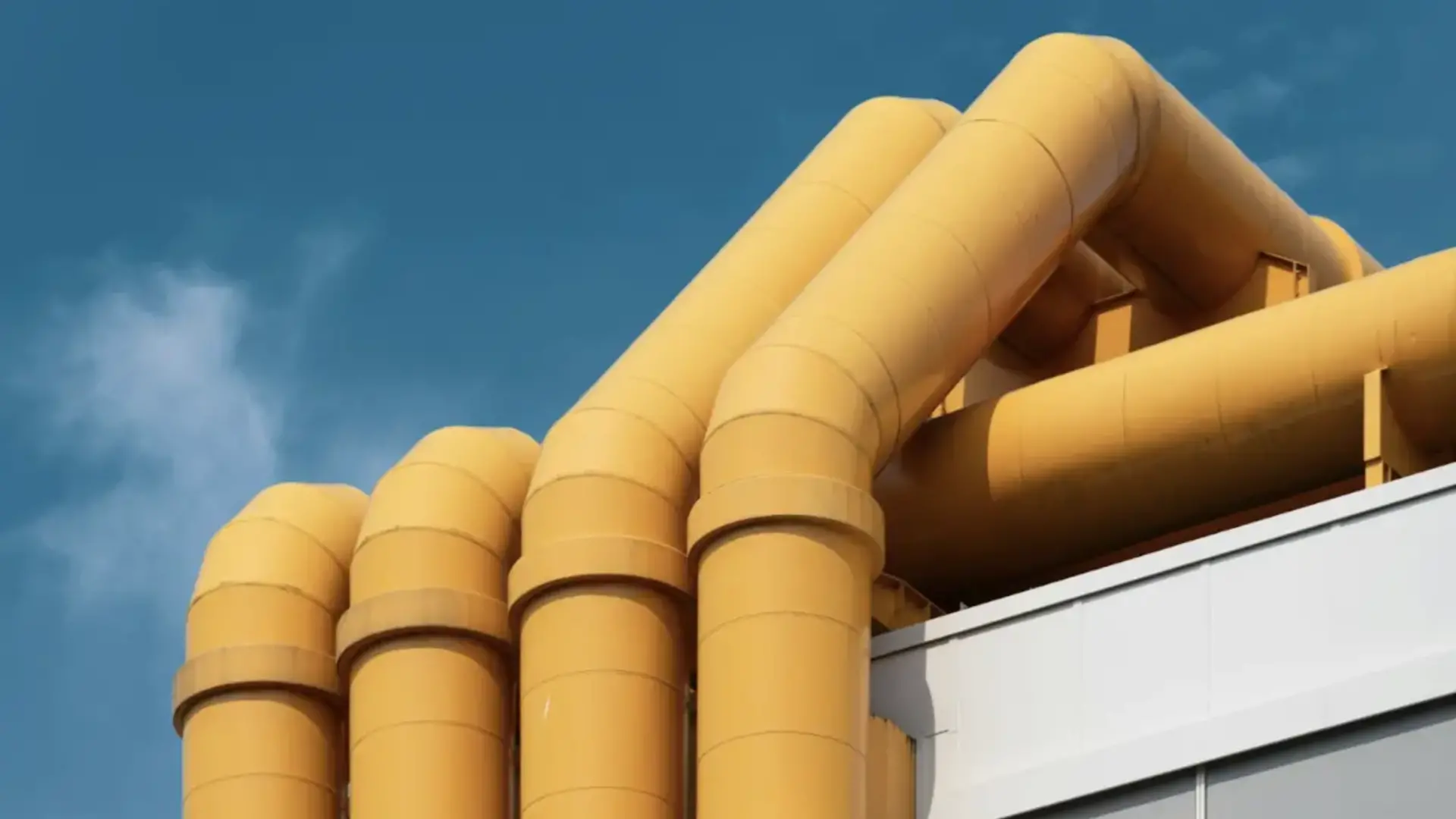 Large industrial yellow gas pipes.