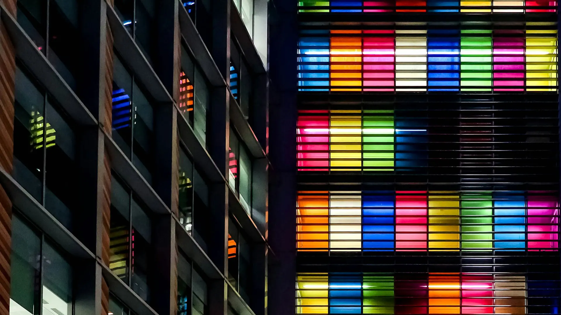 picture of colorful windows on tall building