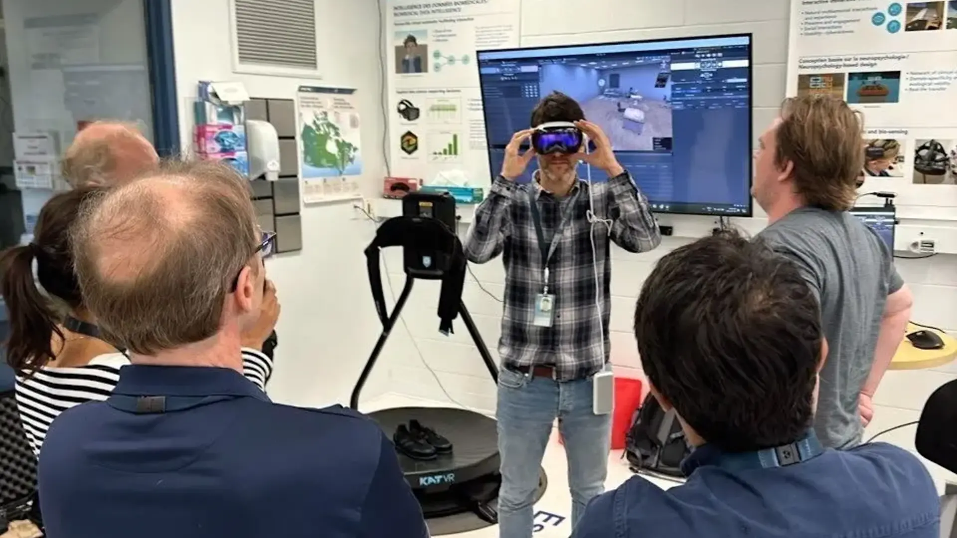 A group of researchers at the National Research Council in Brossard tests out SilicoLabs' platform, LABO, and the Apple Vision Pro.