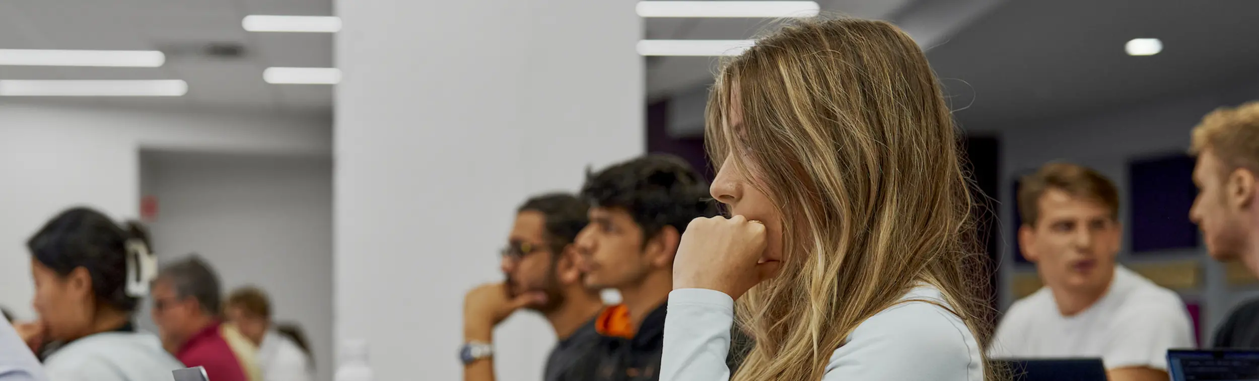 A student in a crowded classroom.