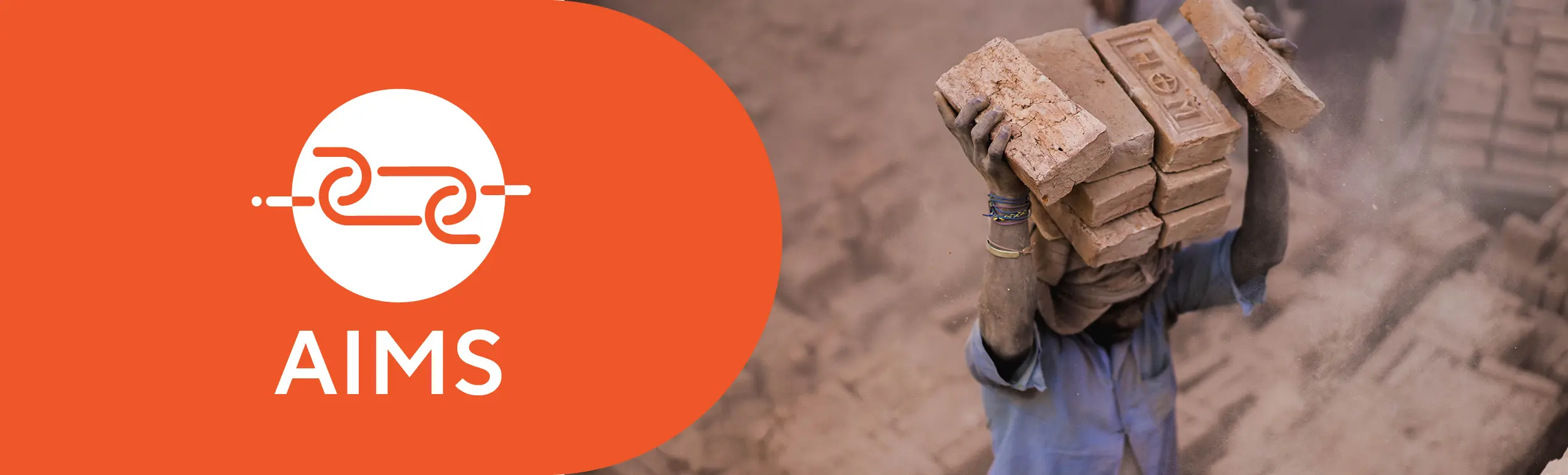 Logo of the project and photo of a man carrying heavy bricks on his head.