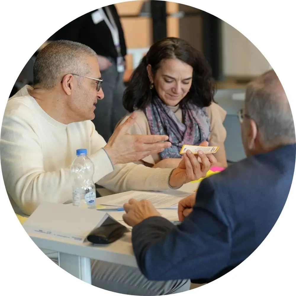 2 participants of TRAIL program sitting at a table during a workshop