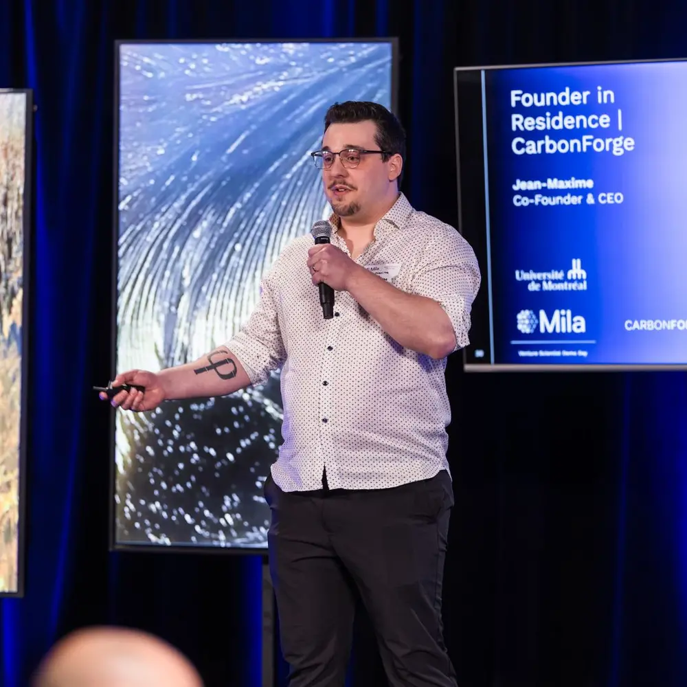 a founder of a startup presenting his company during a pitch session