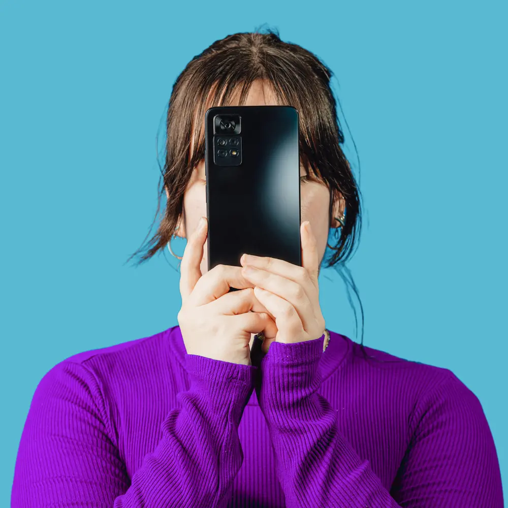 a women with her cellphone in front of her face