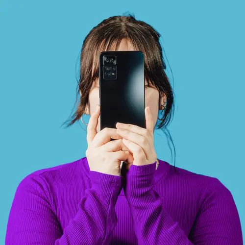 a women with her cellphone in front of her face