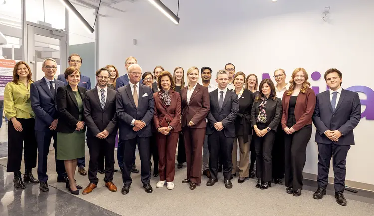 Picture of Sweden Delegation in front of Mila Logo