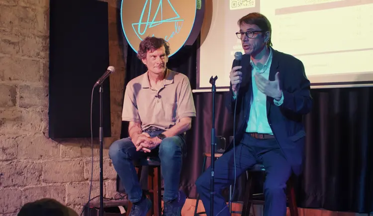 two speakers on stage during the After Mila event