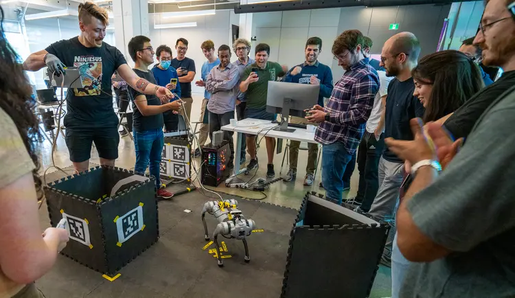 The Mila's Robotics Summer School Robotics participants trying to move a robot