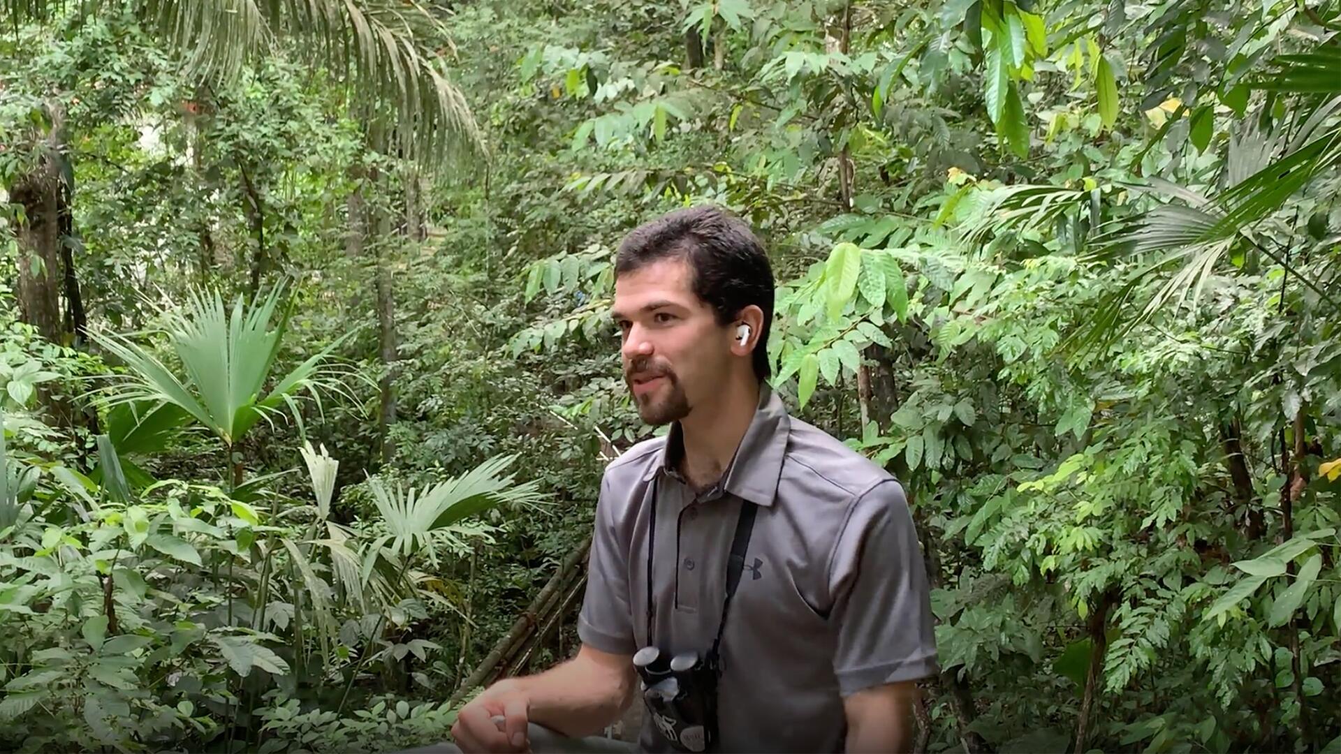 Professor David Rolnick speaking in the rainforest of Panama. 