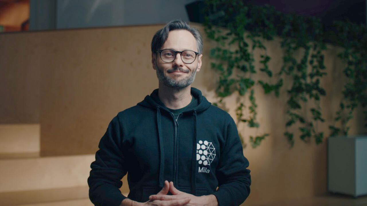 Photo of Hugo Larochelle speaking to the camera. 